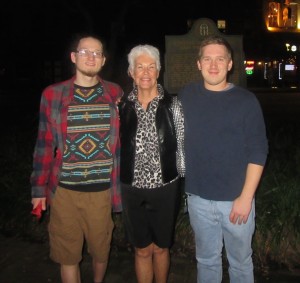 Susan poses with the young men.