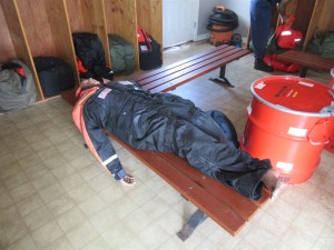 The gear room, with a dummy in a survival suit
