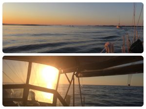 Sun beginning to rise as we head out the Masonboro Inlet; glare on the windshield and dodger in the inlet.